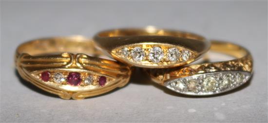 Three early 20th century 18ct gold and gem set rings.